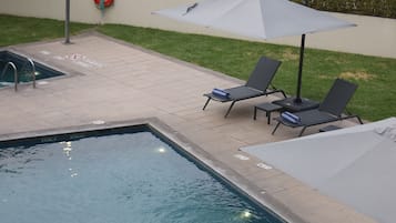 Outdoor pool, open 8 AM to 9 PM, sun loungers