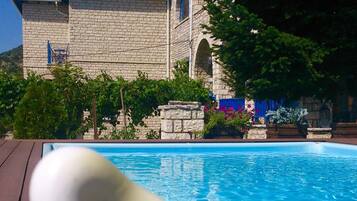 Outdoor pool, open 10:00 AM to 7:00 PM, pool loungers