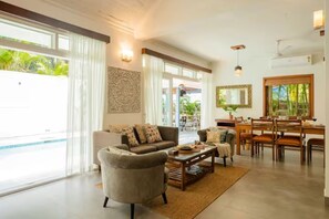 4 bedroom Presidential Pool Villa | Living area | 32-inch LCD TV with satellite channels, TV - Aguada Anchorage - The Villa Resort (Candolim)