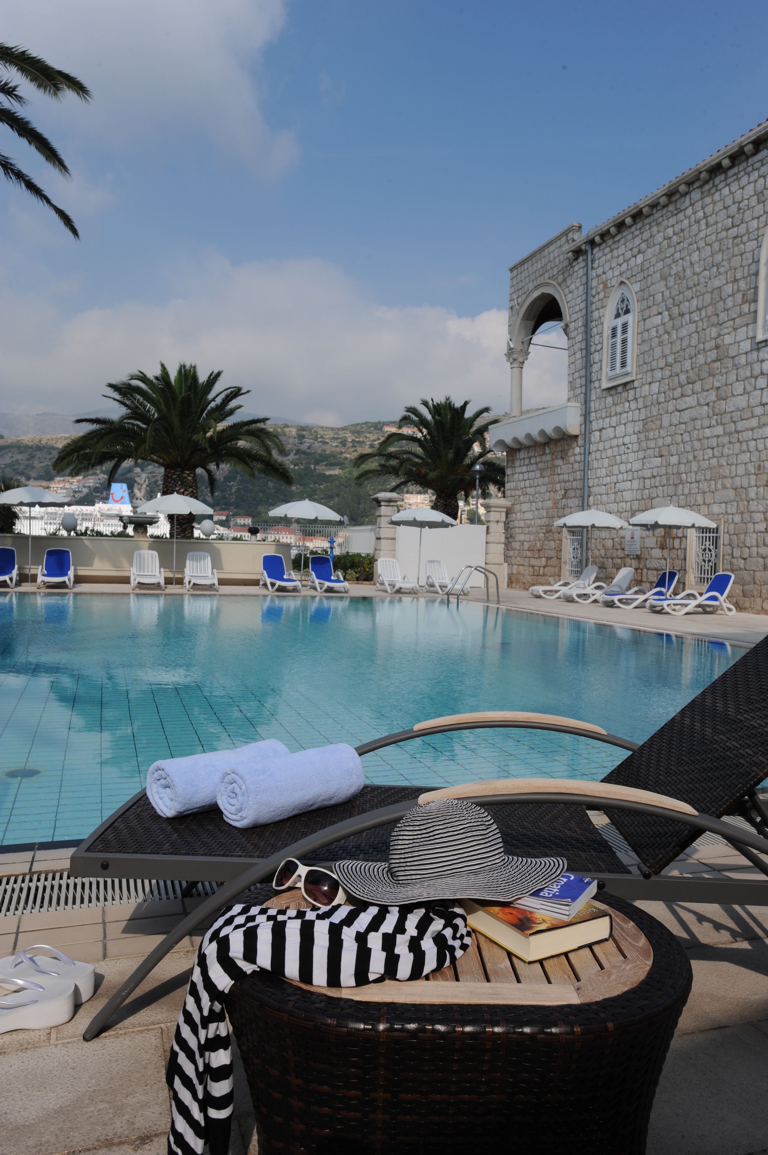 Outdoor pool, pool umbrellas, sun loungers