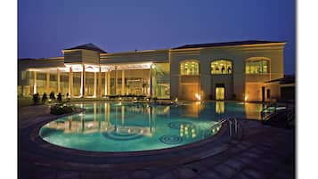 Outdoor pool, open 7:00 AM to 7:00 PM, pool umbrellas, pool loungers