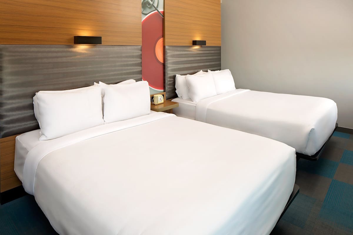 Premium bedding, down comforters, pillowtop beds, in-room safe
