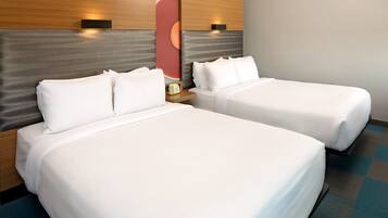 Premium bedding, down comforters, pillowtop beds, in-room safe