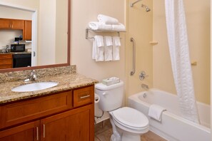 A bathroom with a sink, toilet, and bathtub. - Candlewood Suites ABILENE by IHG (Abilene)