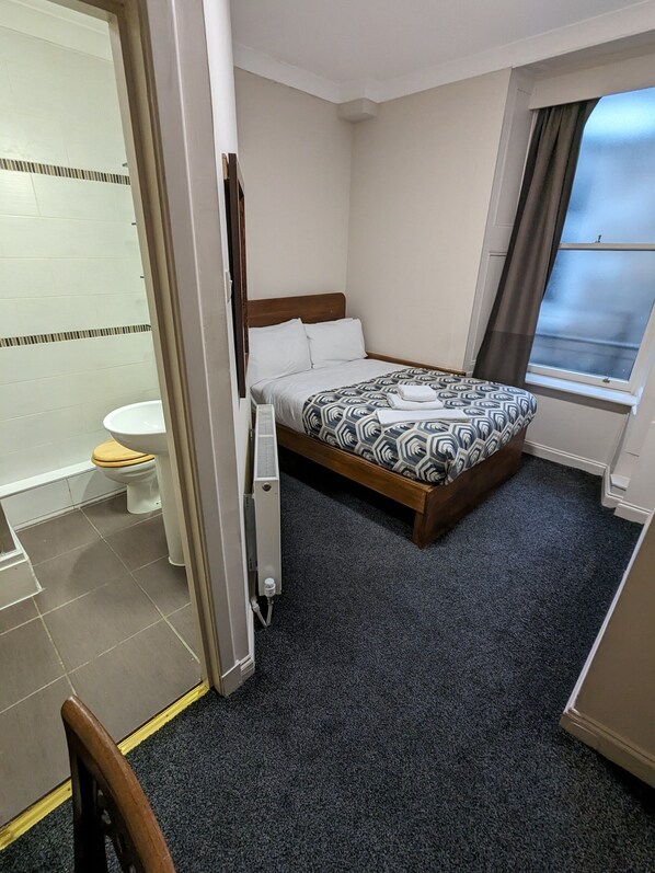 Economy Double Room | Blackout curtains, iron/ironing board, free WiFi, bed sheets