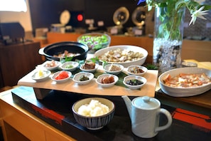 A variety of dishes on a wooden serving board, including rice, soup, and various side dishes. - Rembrandt Style Tokyo Nishikasai (Tokyo)