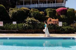 Seasonal outdoor pool, open 8:00 AM to 8:00 PM, pool loungers