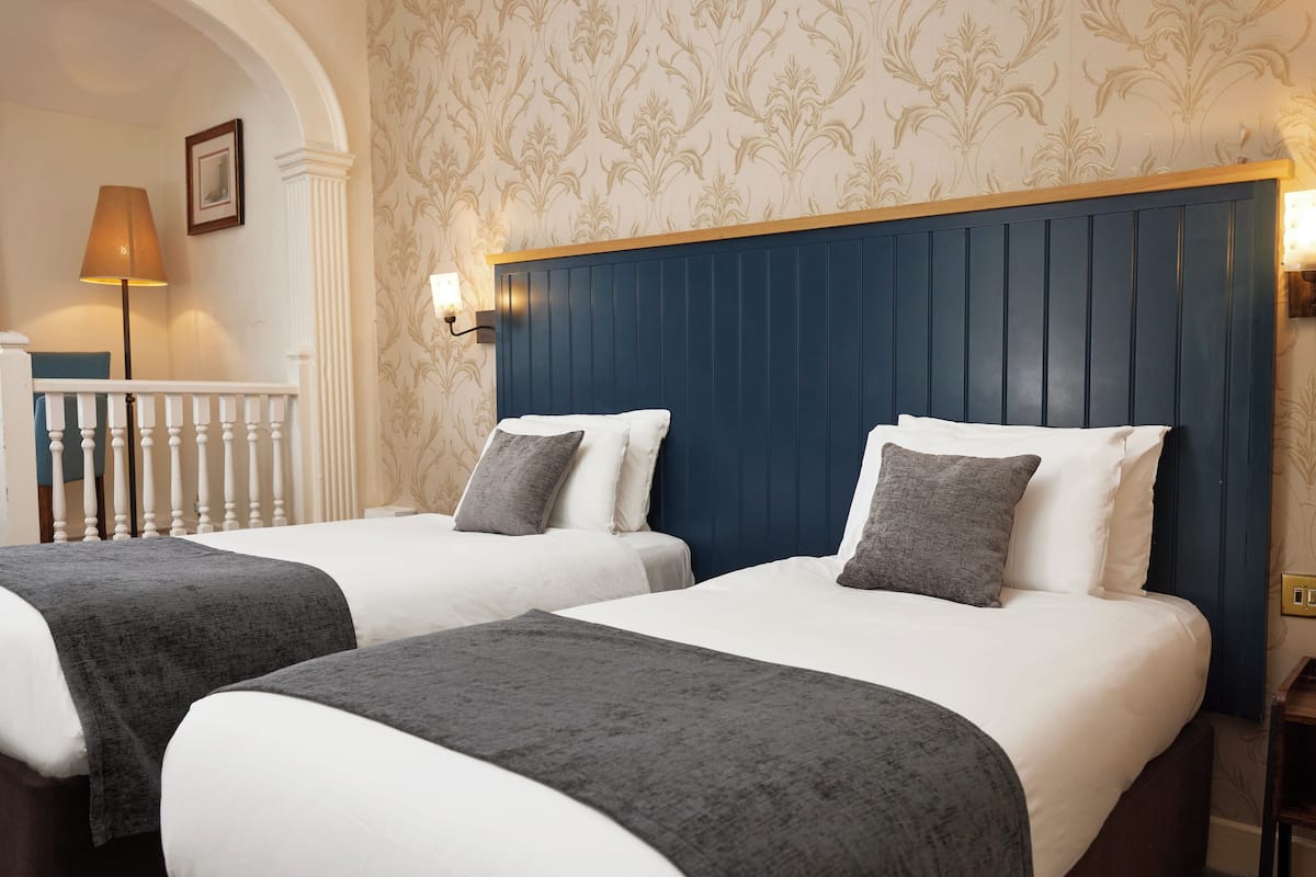 standard twin room, 2 single beds | 1 bedroom, desk, iron/ironing board, free cots/infant beds