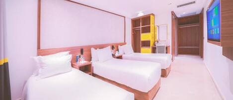 Chambre Triple Deluxe | Literie de qualité supérieure, couette en duvet d'oie