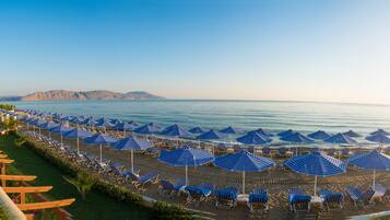 On the beach, sun loungers, beach umbrellas, beach towels