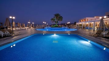 Seasonal outdoor pool, pool umbrellas, pool loungers