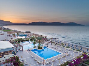 A resort with a large pool, beach area, and mountain views. - Hydramis Palace Beach Resort (Apokoronas)