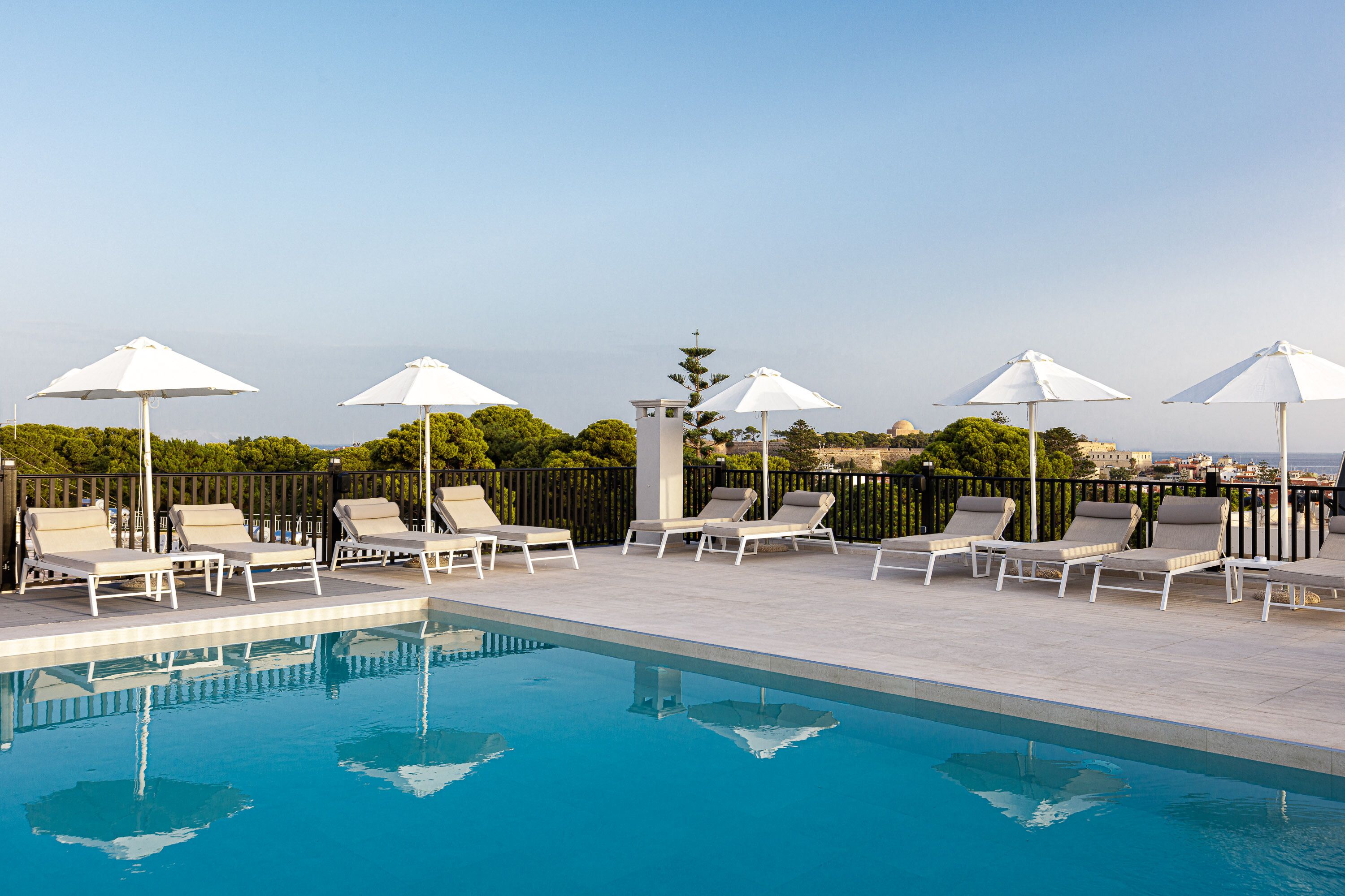 Outdoor pool, open 8:00 AM to 8 PM, pool umbrellas, sun loungers
