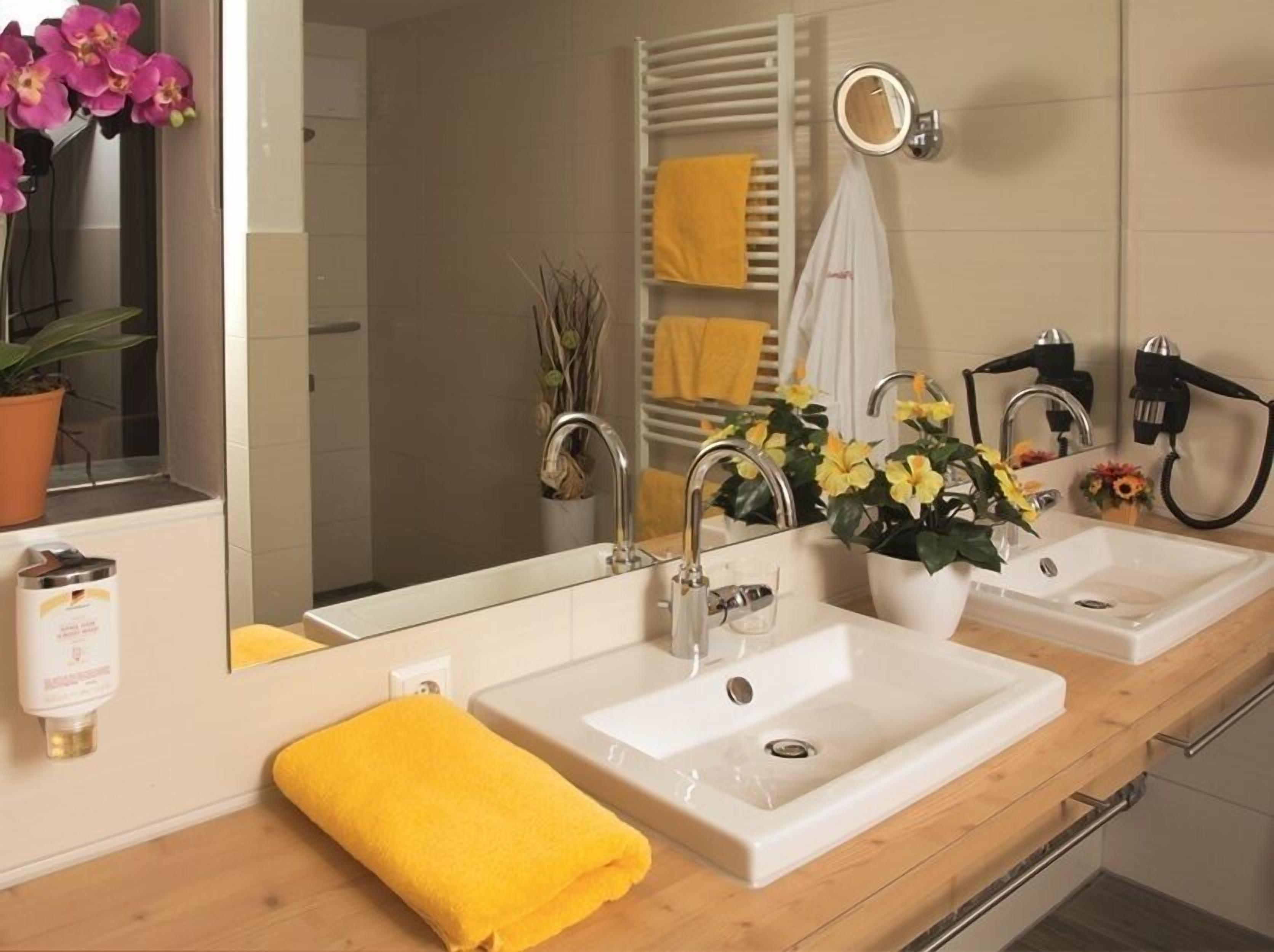 deep-soaking bathtub, hair dryer, heated floors, towels