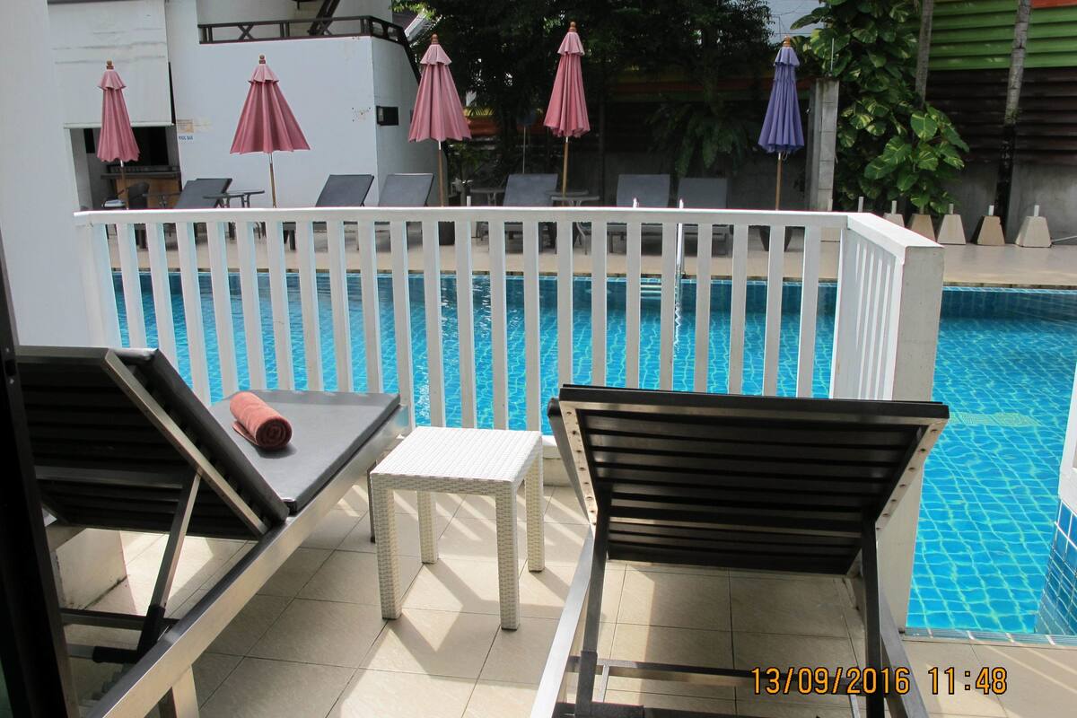 Deluxe Room, Pool Access | Minibar, in-room safe, desk, laptop workspace