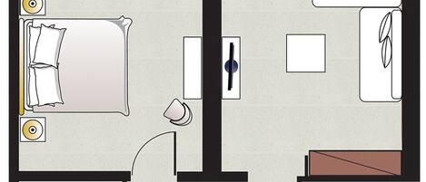 A hotel room layout with a bed, a desk, a bathroom, and a small sitting area.