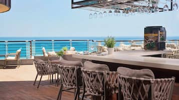 5 bars/lounges, poolside bar, beach bar