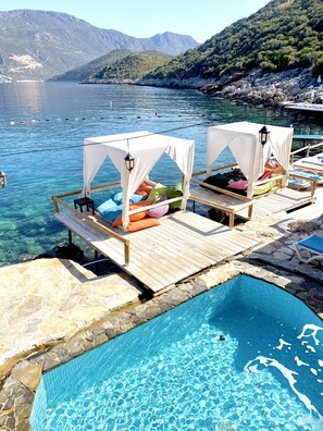 8 outdoor pools, pool umbrellas, sun loungers