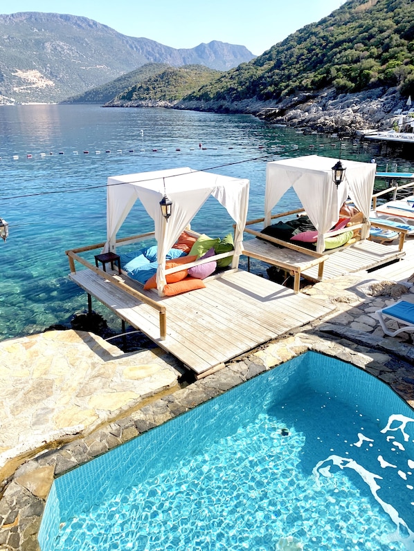 8 outdoor pools, pool umbrellas, pool loungers