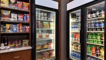 A vending machine with snacks, beverages, and condiments.