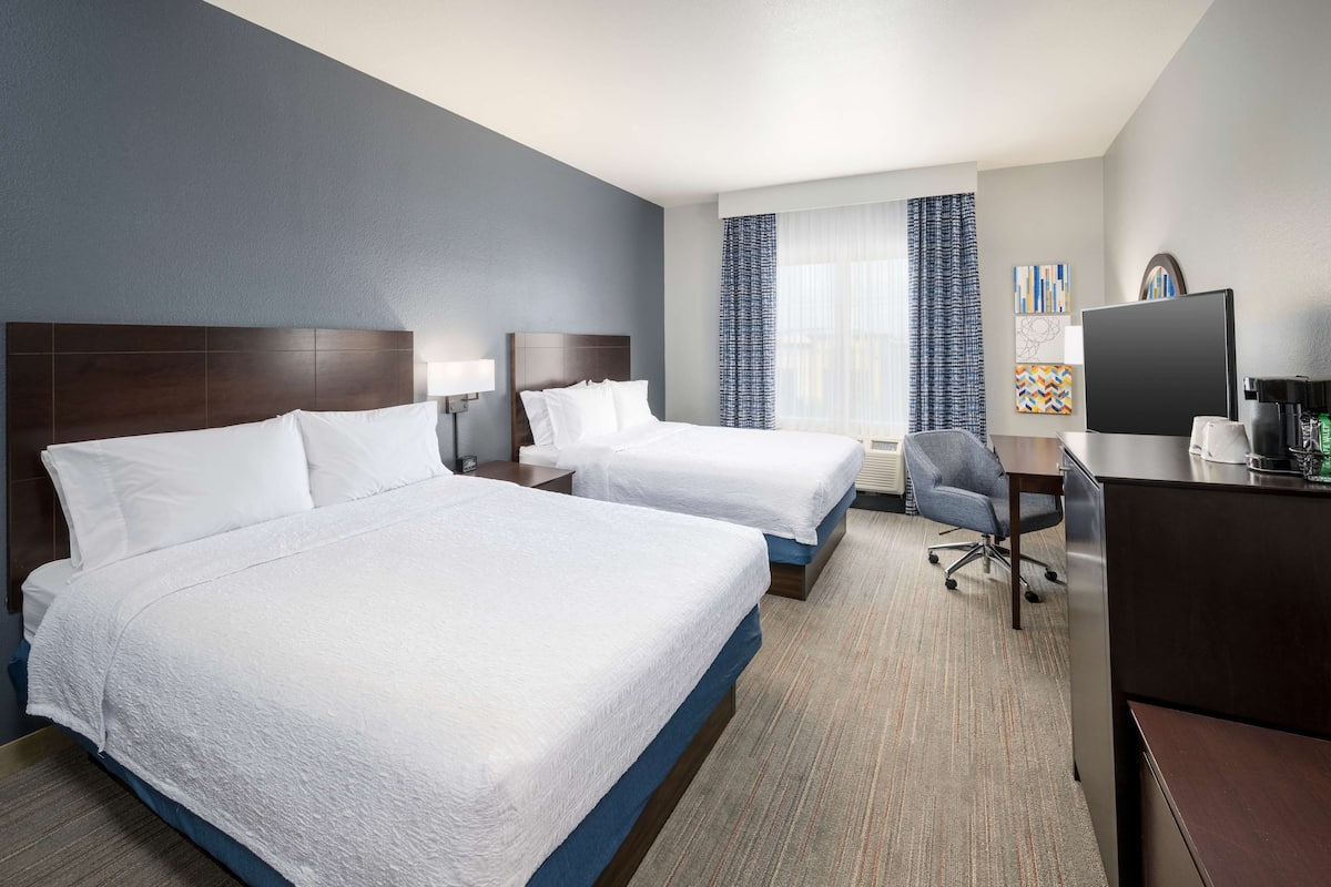 premium bedding, laptop workspace, blackout curtains, iron/ironing board