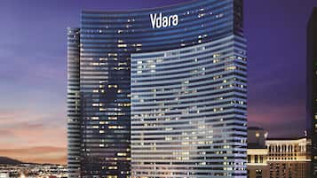 A modern high-rise building with the name 'Vdara' prominently displayed at the top.