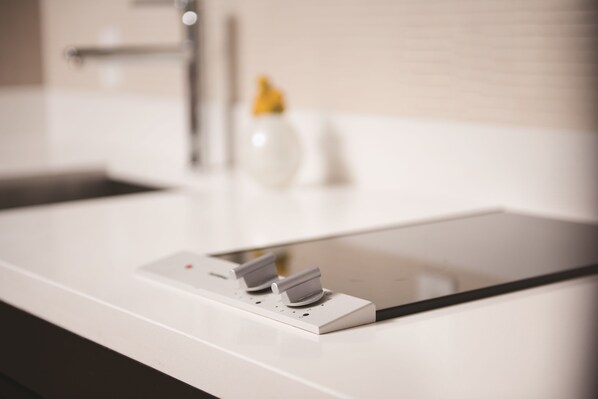 A modern bathroom sink with a mirror and a faucet.