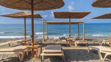 On the beach, sun loungers, beach umbrellas, beach towels