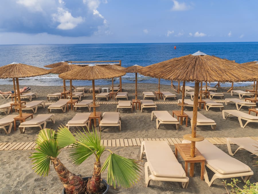 On the beach, sun loungers, beach umbrellas, beach towels
