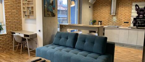 Studio Suite (1a Sholudenko street) | Living area | TV, fireplace