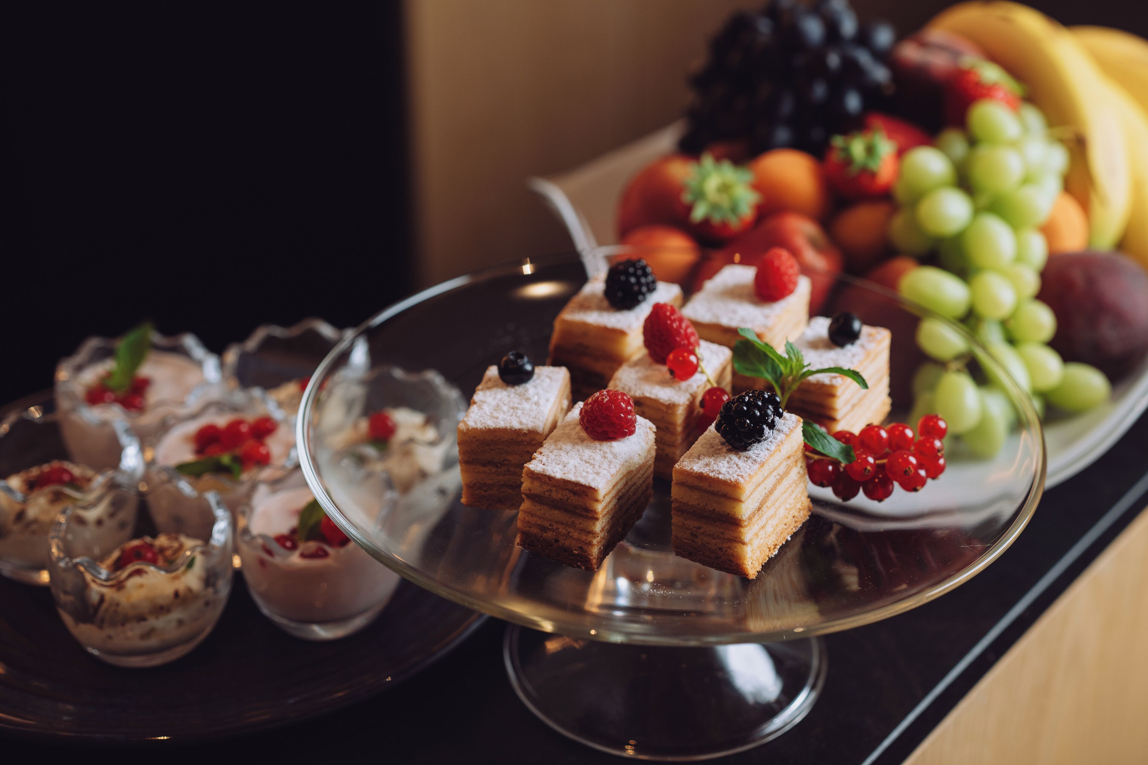 A dessert platter with various pastries and fruits.