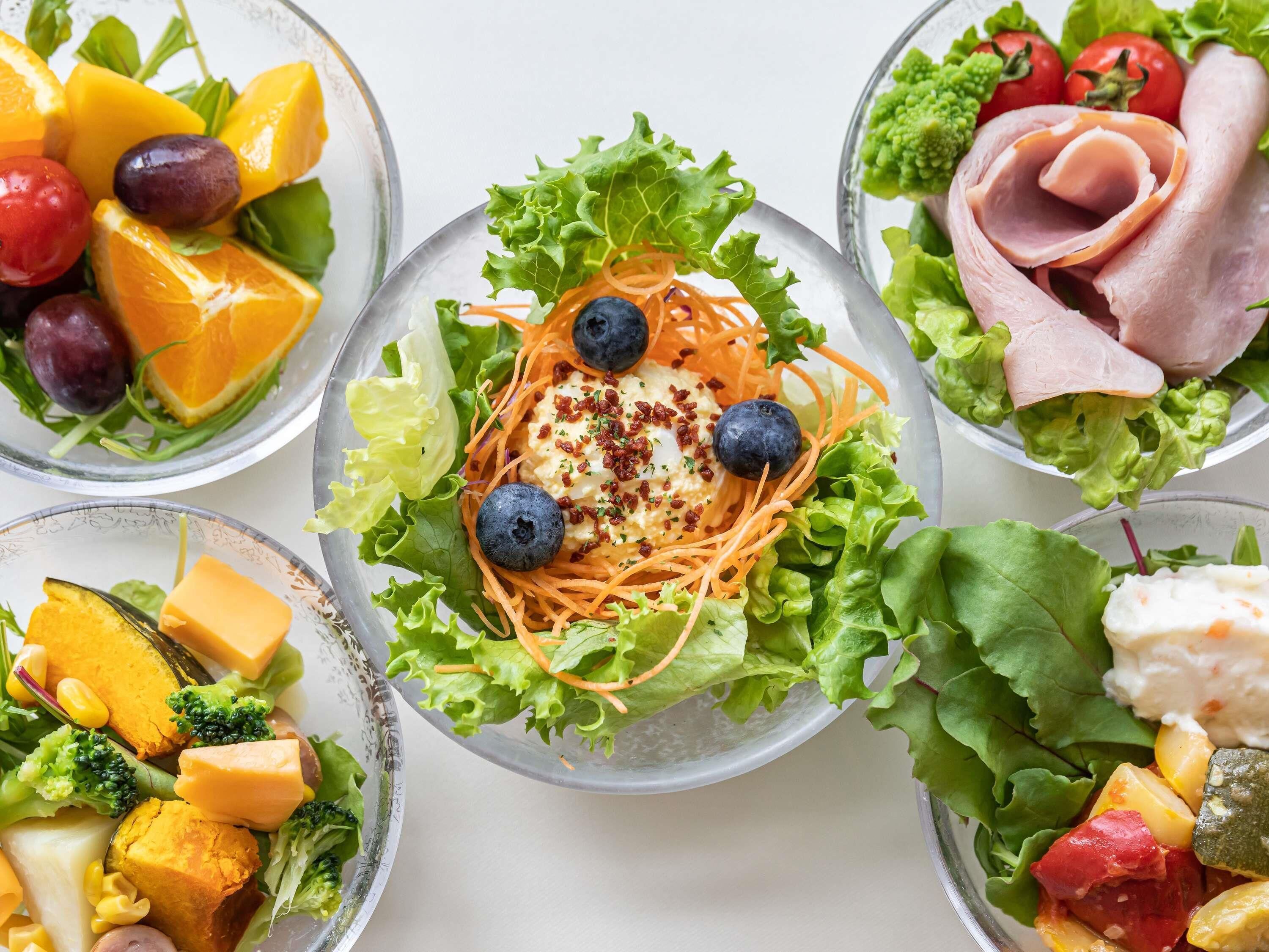 A variety of salads with different ingredients.