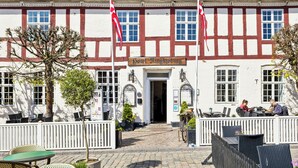 A traditional half-timbered building with a sign reading "Hotel Königshof". - Hotel Ringkjøbing (Ringkobing)