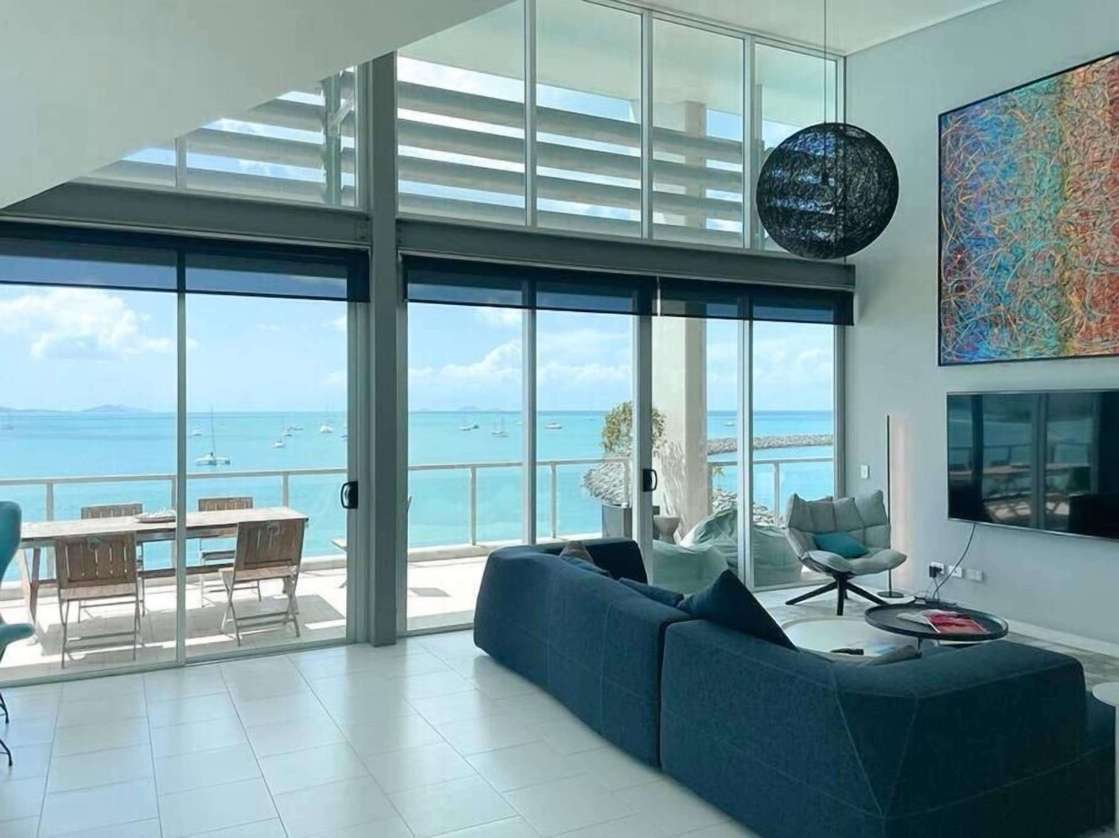 3 Bed 3 Bath Executive Deluxe Penthouse Apartment | Living area | Flat-screen TV, DVD player