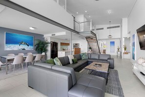 4 Bedroom 3 Bathroom Waterfront Loft Penthouse | Living area | Flat-screen TV, DVD player - Peninsula Airlie Beach (Airlie Beach)