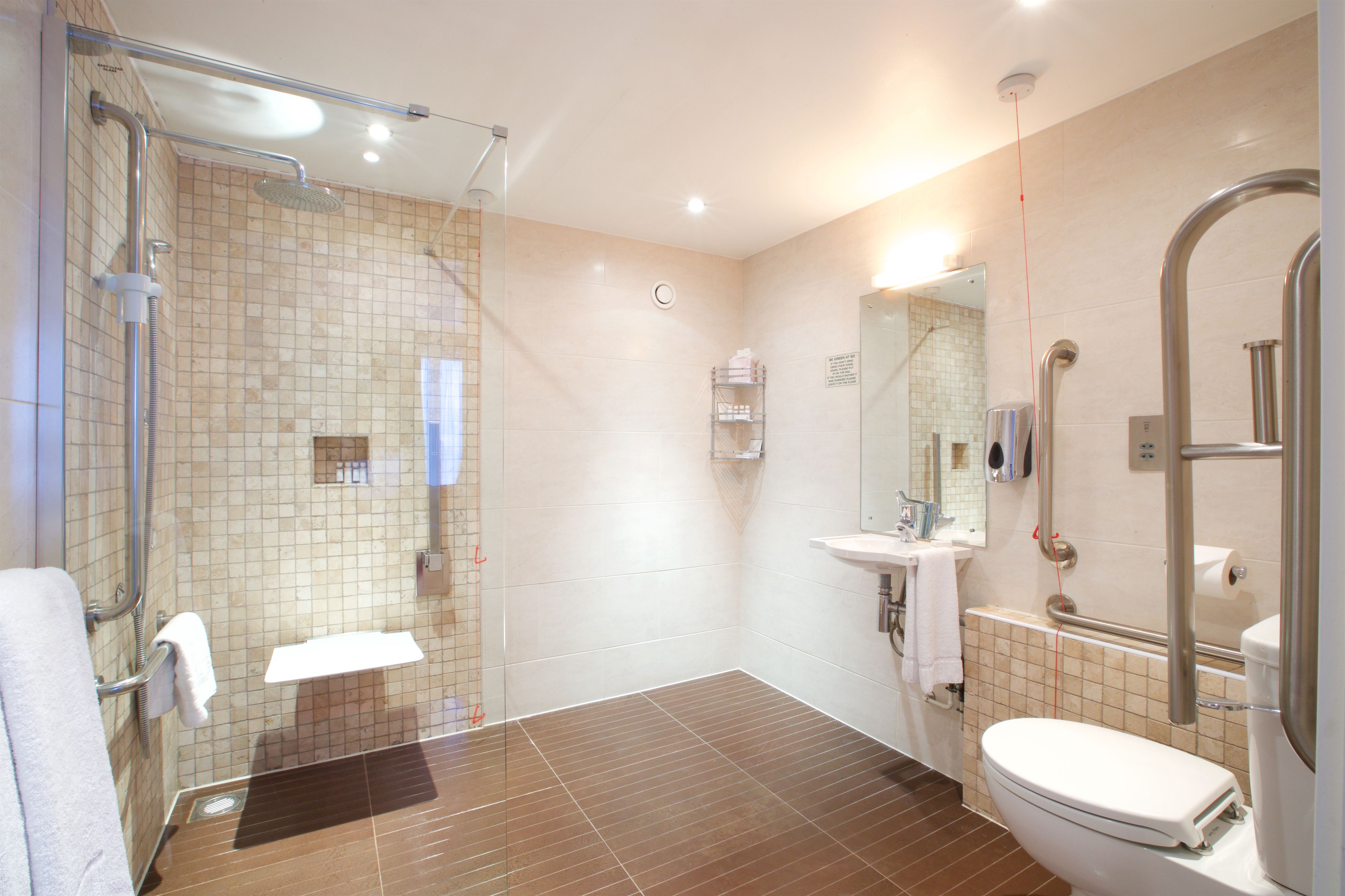 family room | bathroom | shower, rainfall showerhead, free toiletries, hair dryer