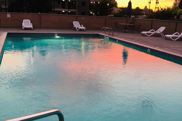 Seasonal outdoor pool, open 10:30 AM to 10 PM, pool umbrellas