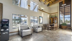 A spacious lobby with an ATM, seating area, and large windows. - Best Western Plus Bryce Canyon Grand Hotel (Bryce Canyon)