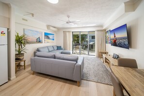 One Bedroom Apartment | Living area | 42-inch flat-screen TV with cable channels, TV, DVD player - Coolum at the Beach (Coolum Beach)