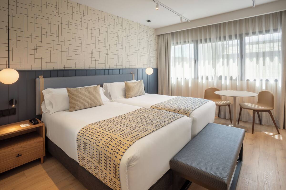 Premium bedding, down comforters, minibar, in-room safe