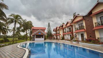 Outdoor pool, open 7:00 AM to 7:30 PM, pool umbrellas, pool loungers