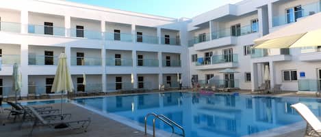 Outdoor pool, pool umbrellas, pool loungers