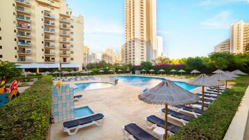 Seasonal outdoor pool, open 9 AM to 7 PM, sun loungers