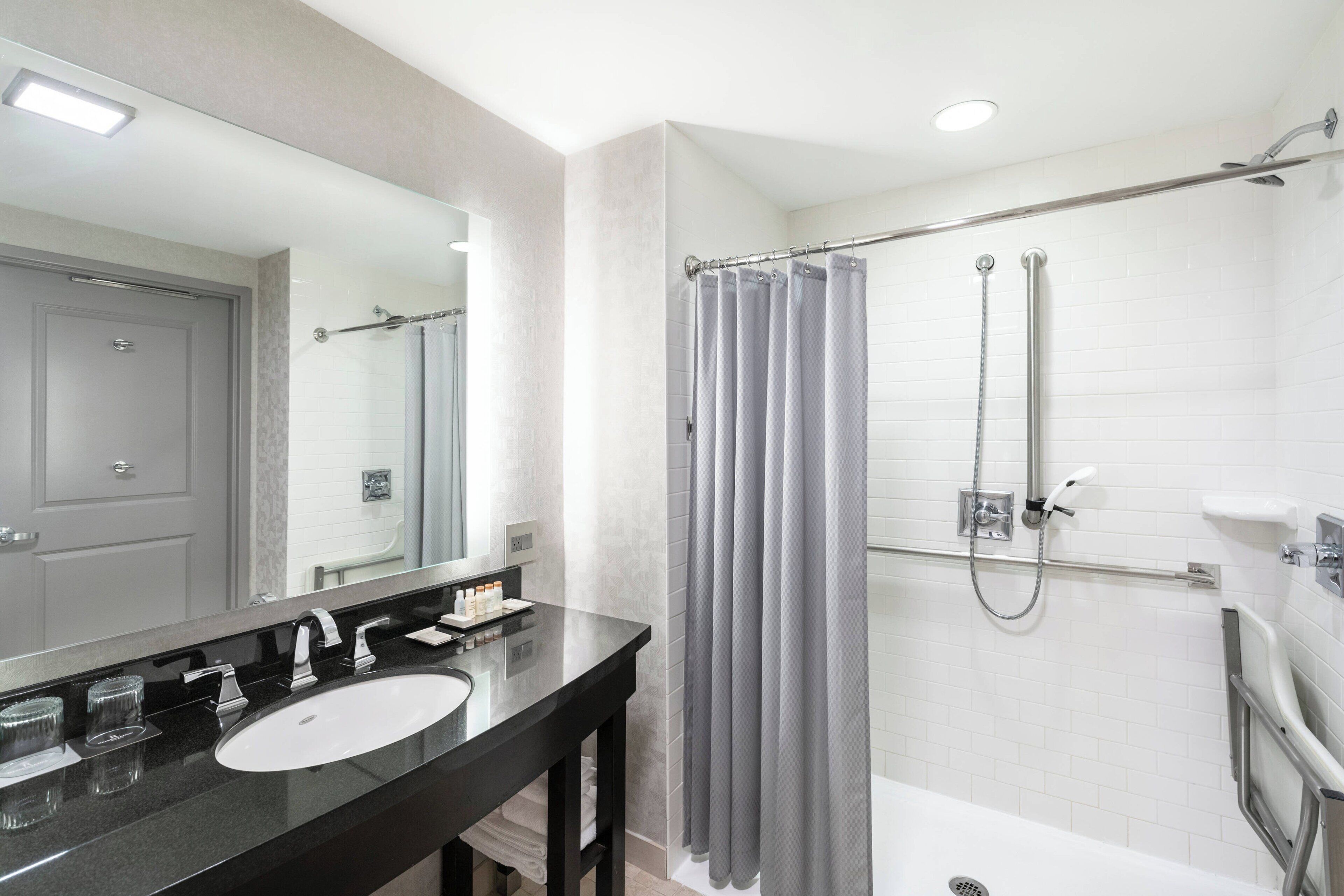 combined shower/bathtub, designer toiletries, hair dryer, bathrobes