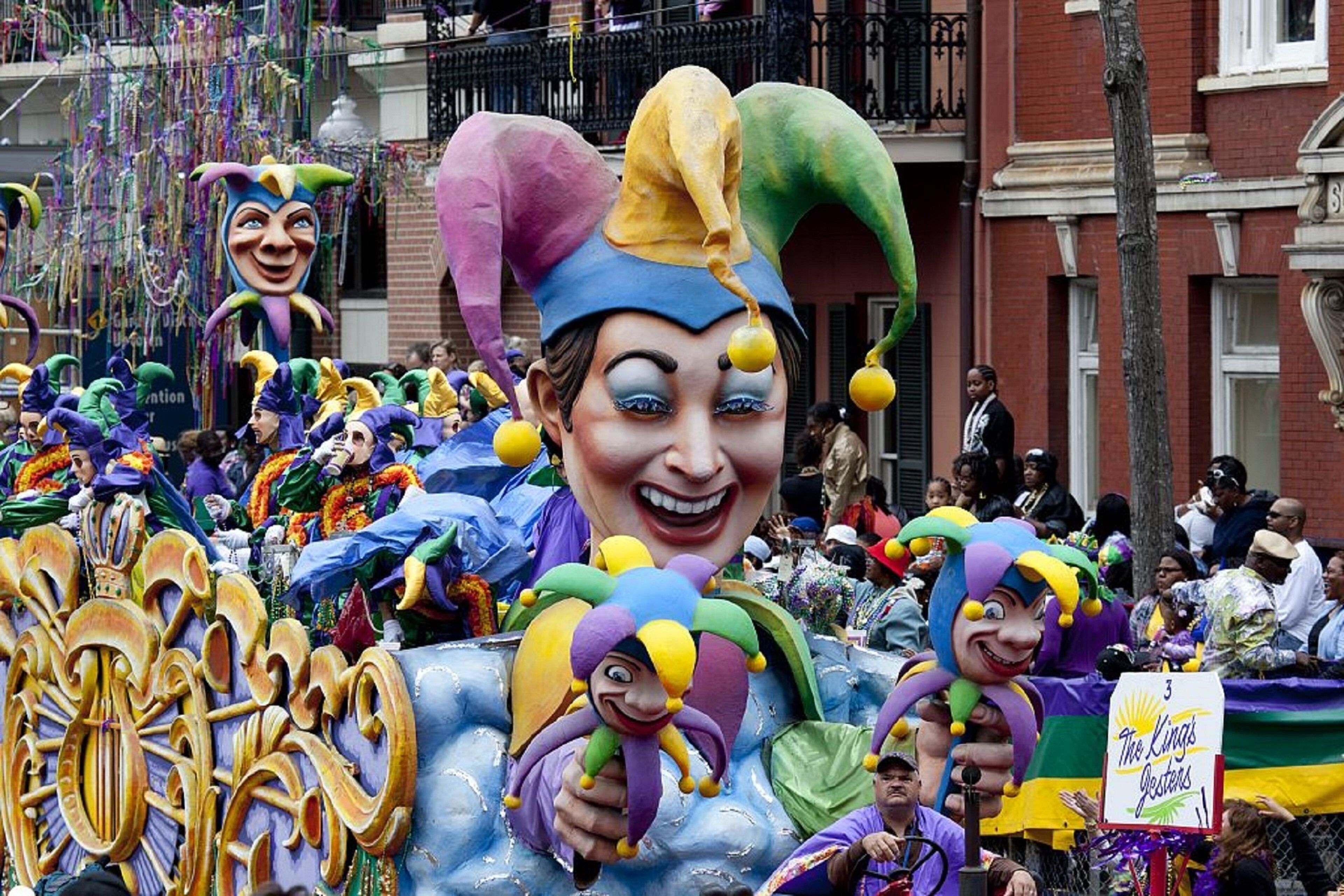 A parade float with colorful decorations and a sign that reads 'The King's Gestures.'