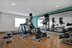 A gym with various exercise equipment including treadmills, stationary bikes, and weight machines. - Holiday Inn Express Atmore by IHG (Atmore)