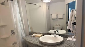 Bathtub, towels, toilet paper