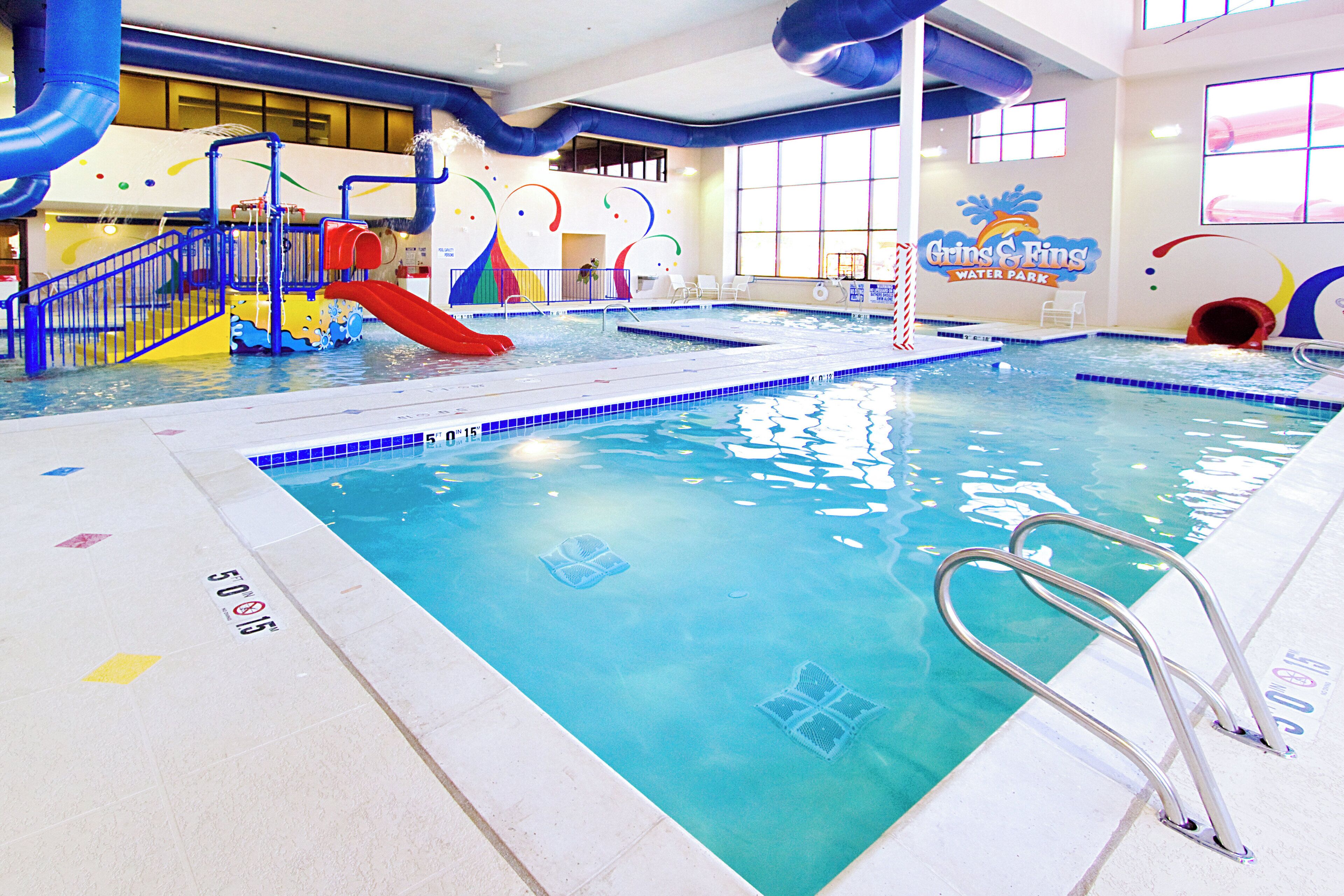 Indoor pool, open 8:00 AM to 9:00 PM, pool loungers, lifeguards on site