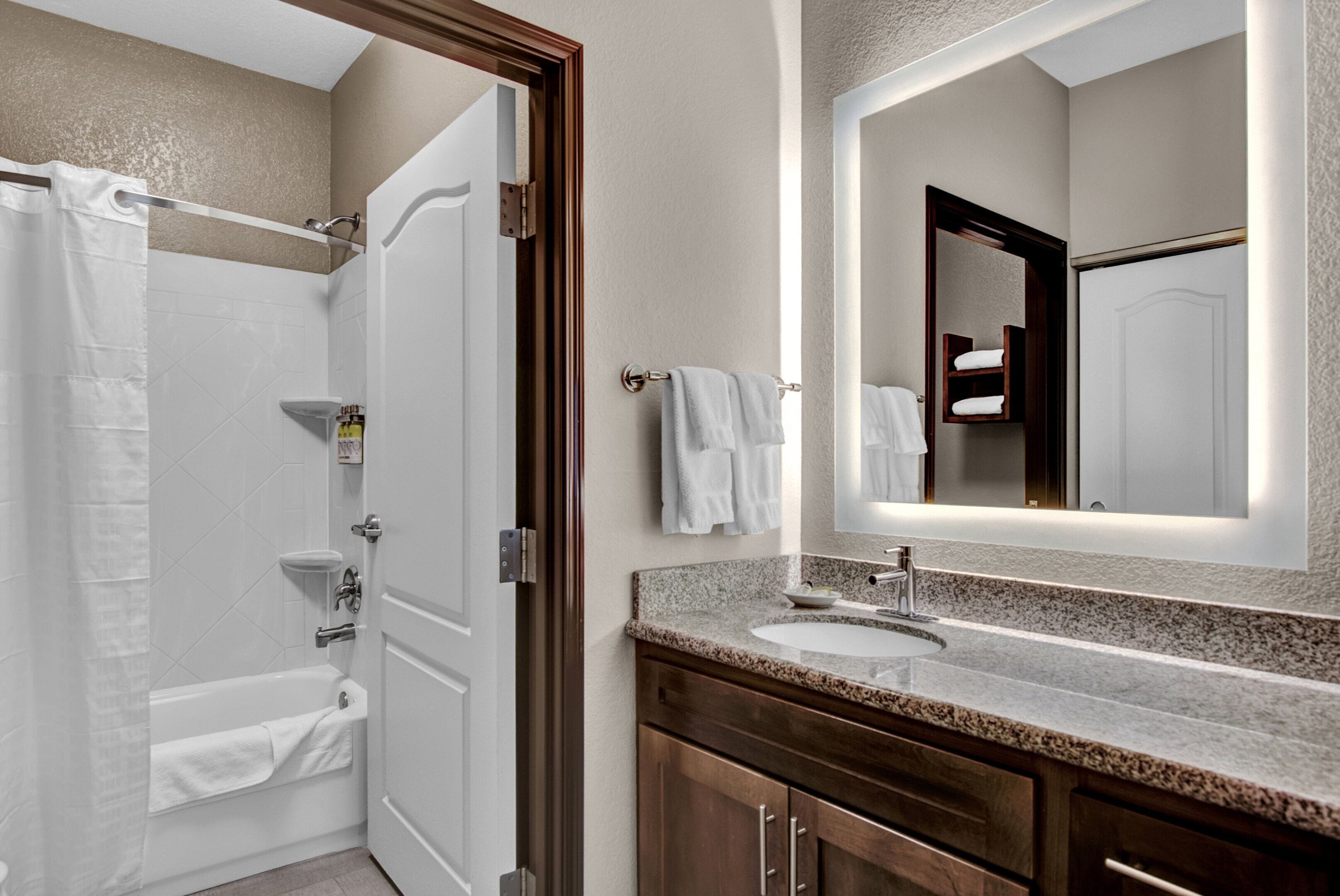 bathtub, free toiletries, hair dryer, towels