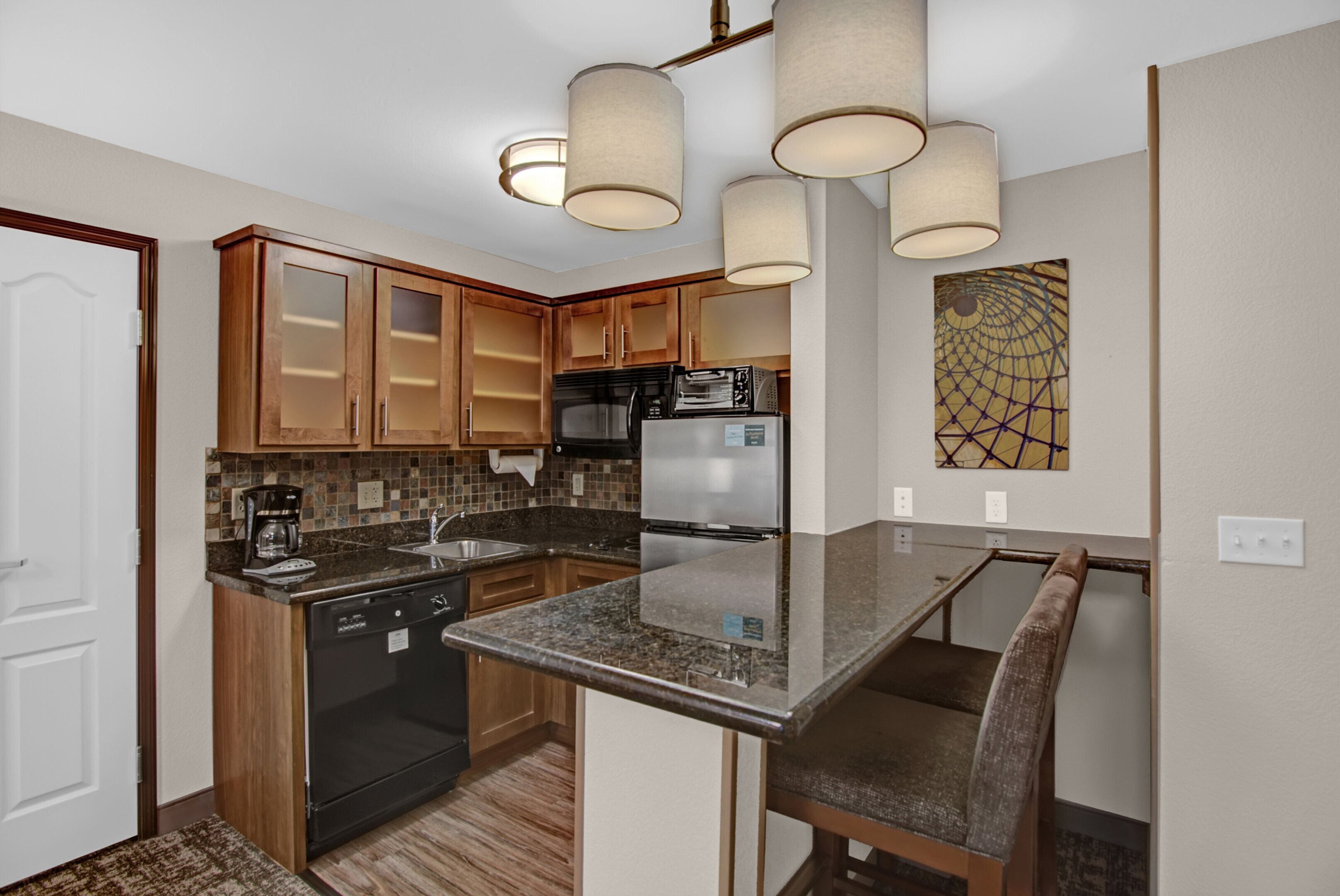 full-sized fridge, microwave, stovetop, dishwasher